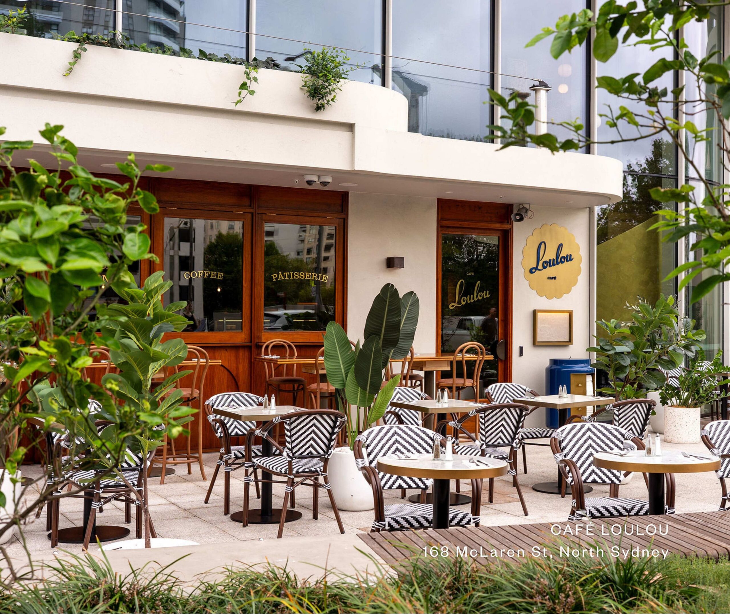 EXTERIOR OF LOULOU CAFE TERRACE WITH CHAIRS TABLE AND GREENERY